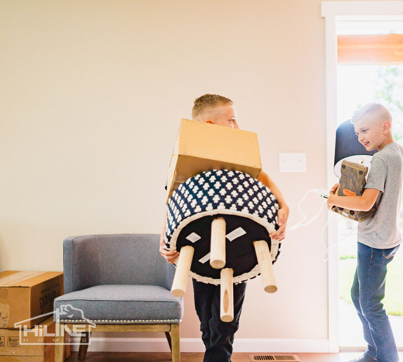 Image of kids helping parents move into their new home.